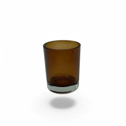 Amber glass votive candle holder, 7cm tall, 5cm diameter, ideal for creating a cozy ambiance.