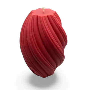Red textured large pillar candle on a white background 