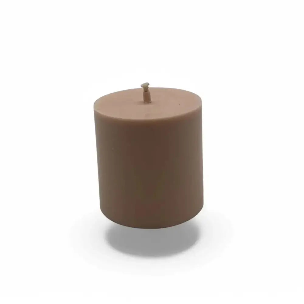 Vanilla scented soy pillar candle with warm and inviting aroma.
