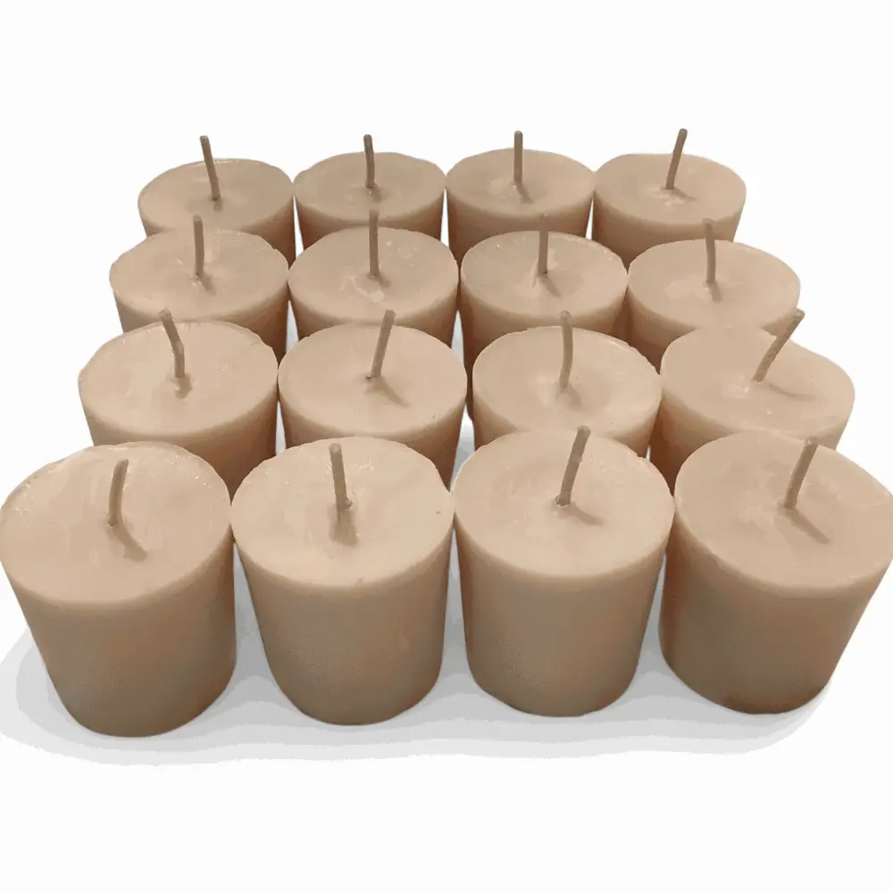 Vanilla Votive Candles made from soy wax, perfect for creating a warm and fragrant ambiance, arranged in a group on a white surface.