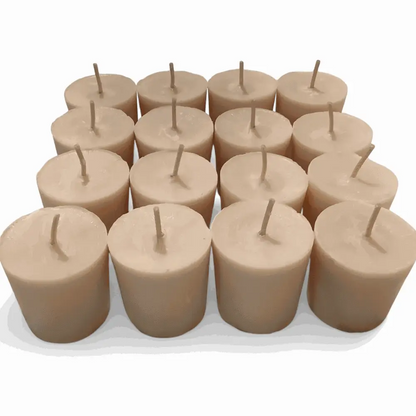 Vanilla Votive Candles made from soy wax, perfect for creating a warm and fragrant ambiance, arranged in a group on a white surface.