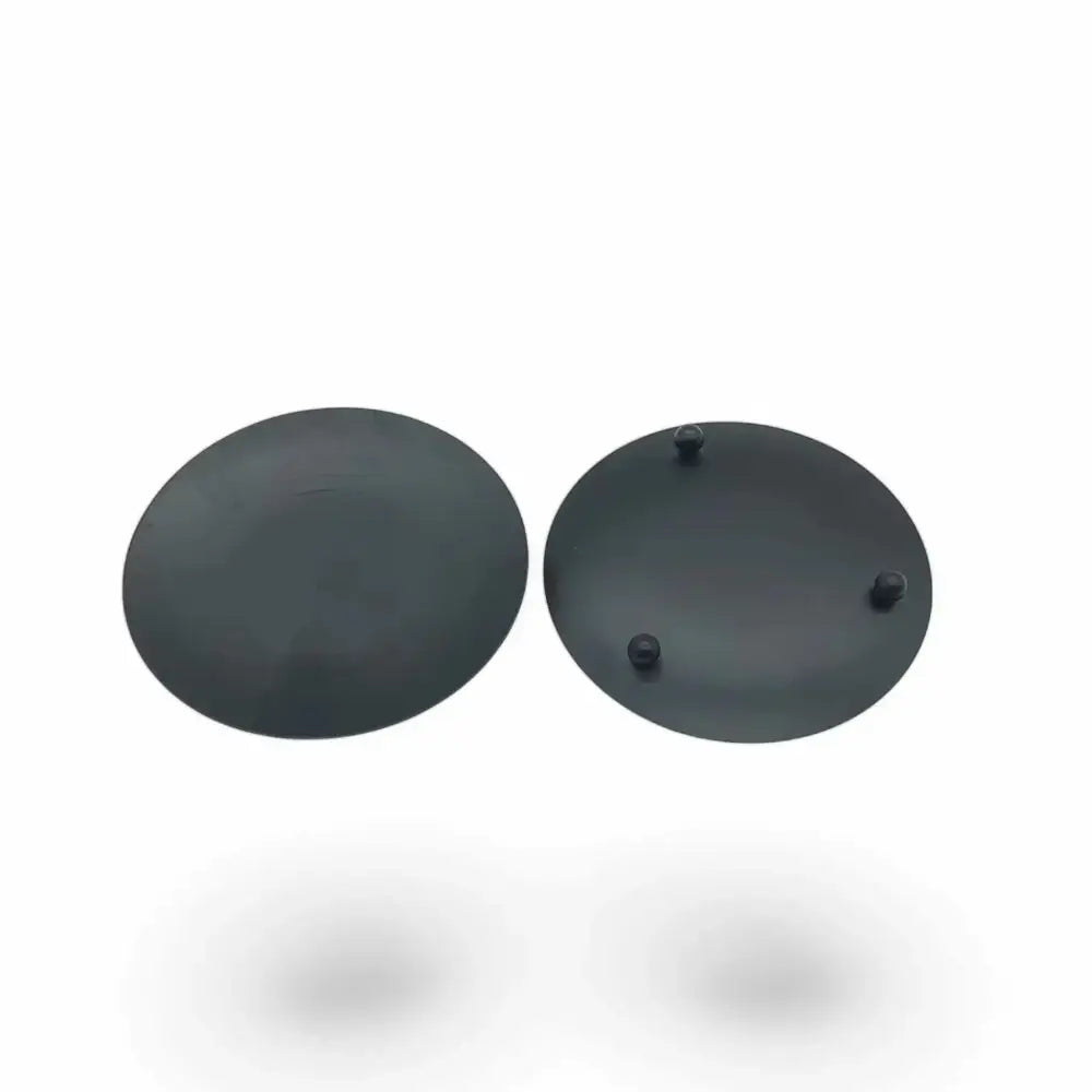 Round wrought iron candle holder with matte black finish and small feet, Nordic-inspired design.